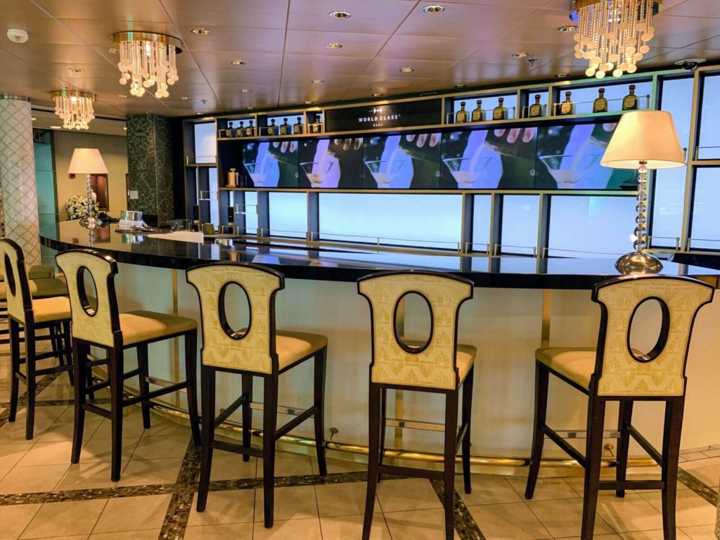 a bar with stools on cruise liner