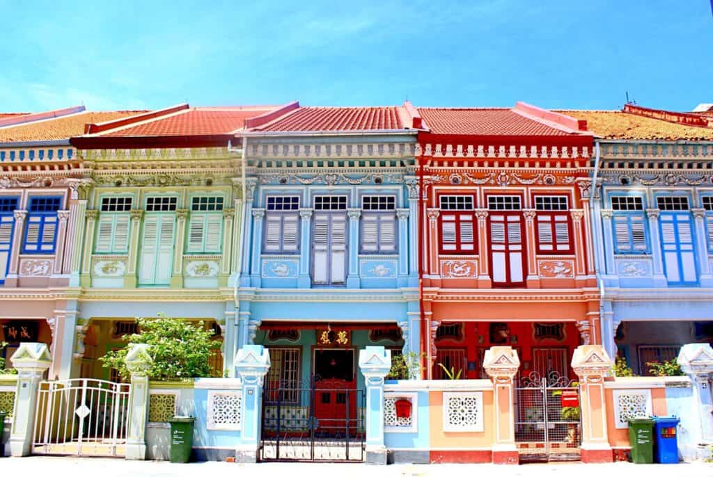 pastel-hued houses in koon seng road singapore with wooden shutters in a Peranakan style