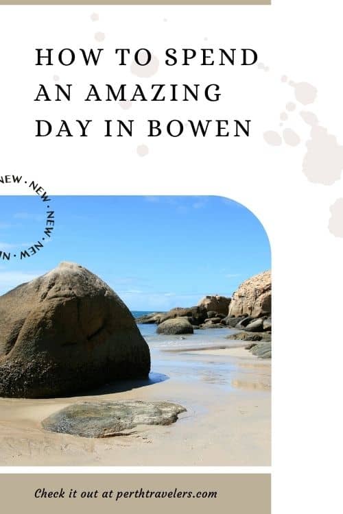 big boulders on a sandy bay beach